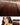 Model im Alltagslook mit Tape-In Extensions in Schoko-Dunkelbraun – Rubin Extensions®