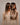 Model von hinten mit Clip-in Echthaar-Extensions in Dirty Blonde – Rubin Extensions®