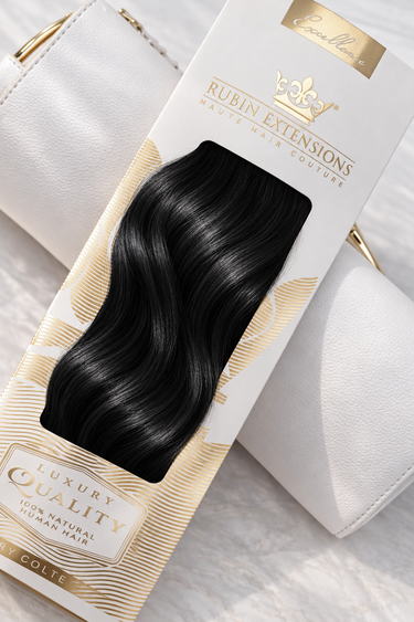 Rubin Extensions Tape-in Excellence Line in Schwarz, mit seidigen Wellen in einer weiss-goldenen Verpackung.